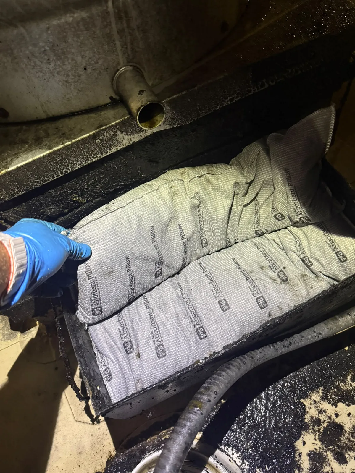 Standard-size grease pillows placed in rooftop grease collection